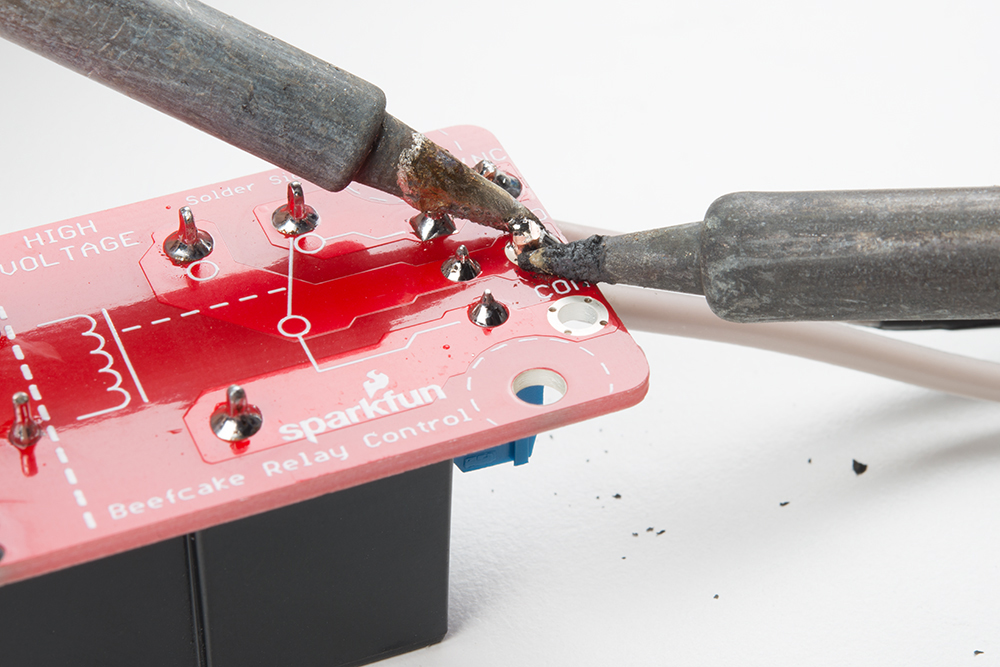 Two Soldering Irons on Joint